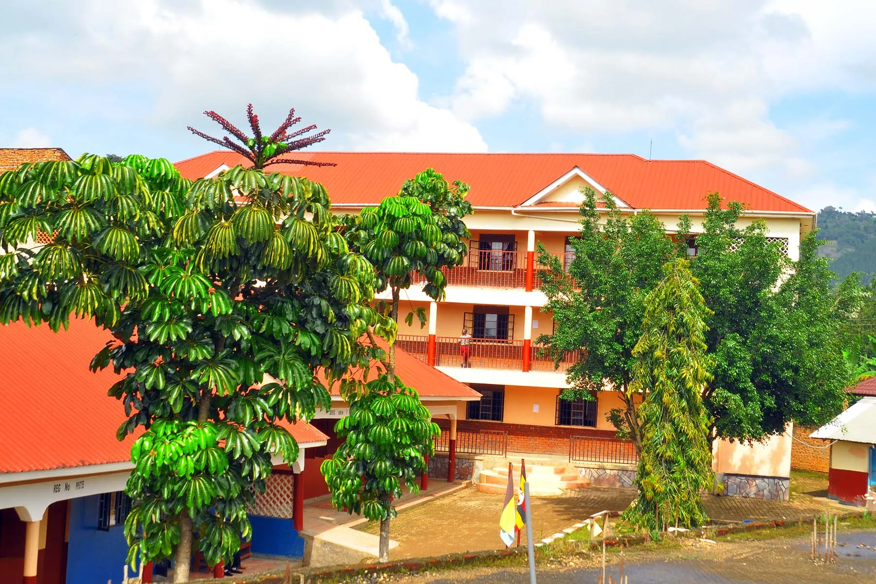 The three-storey classroom block and green courtyard